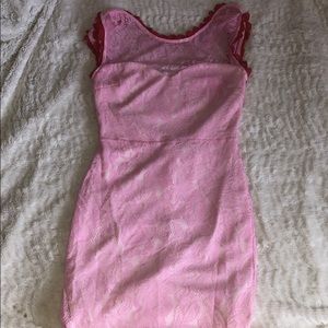 Pink lace bodycon dress with open back design